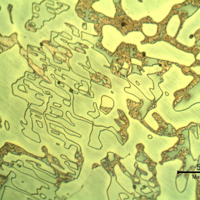 Micrographic detail of the longitudinal section of the cast sleeve in the middle of the thickness. The microstructure is duplex, austenitic and ferritic.  The etch presents different colours for the phases.  The yellow is associated to detrimental phases, like sigma, at the ferritic phase (ligh blue) and the white phase is the austenite.