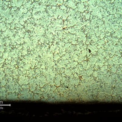 Micrography of the longitudinal section of the cast sleeve, close to the internal diameter  (ID). The microstructure is coarse, austenitic ferritic, and presents the same microstructure, ferritic and austenitic, all through the thickness.