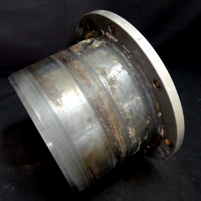 General view of the 10" diameter flanged sleeve, 1/2" wall thickness, manufactured by centrifugal casting of lean duplex stainless steel (DSS), Alloy 2304 (without Mo), with an external coating applied by thermal spray (TS).  The sleeve is assembled in a shaft. The internal environment is oil and a seal box is assembled in the external side that is wet with seawater.