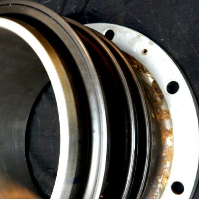 General view of the 10" diameter flanged sleeve, with the external coating applied by thermal spray (TS), and the sealing rings of the seal box assembled at the sleeve external surface.  It is important to observe that the internal surface of the sleeve presents no corrosion spots.