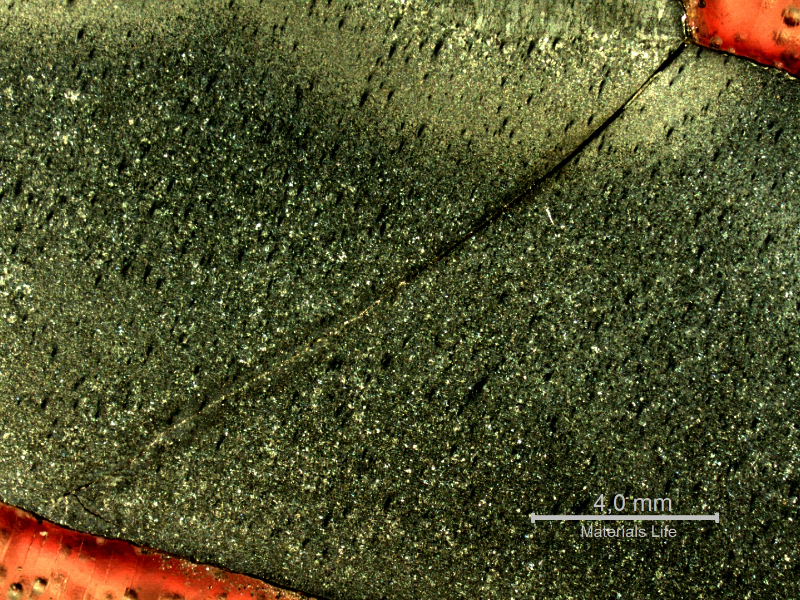 Macrography of a section tranverse to the pipe and to the weld between the 8"pipe and the 2" fitting weldolet.  The crack starts exactly at the margin of the weld, in a geometric stress concentration raiser, in a position where it growths in the pipe longitudinal direction, and propagates in a straight line, not related to any metallurgical aspect.