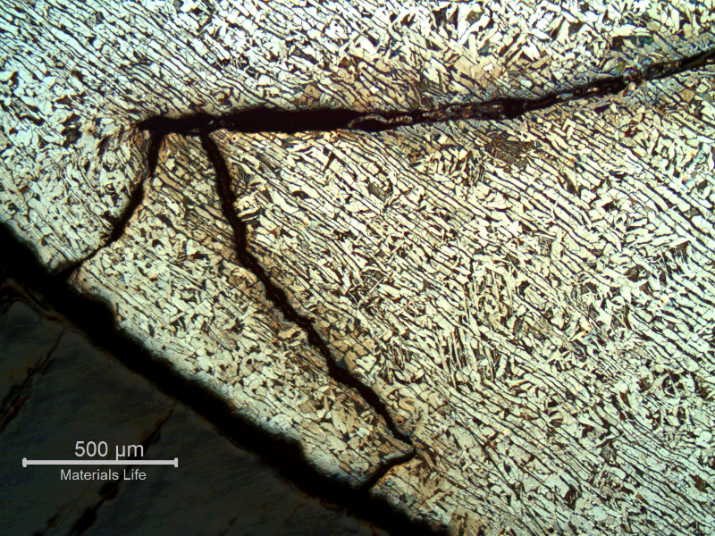 Micrography of a section tranverse to the pipe and to the weld between the 8"pipe and the 2" fitting weldolet.  The crack starts exactly at the margin of the weld and propagates in the pipe longitudinal direction, in a straight line until it reaches the condition of overloading and through wall final rupture, with strong plastic deformation as can be seen around the crack.