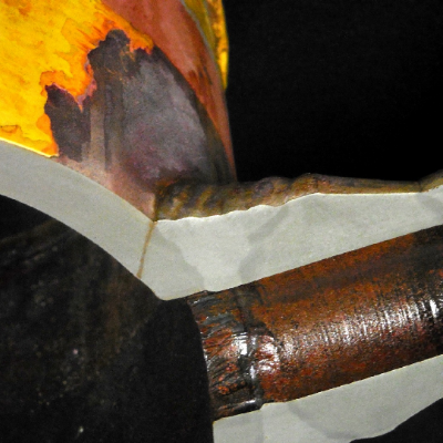 Macrography of a transverse section of the 8" pipe, cut exactly in the middle of the lateral 2" branch line, showing the through thickness crack initiated at the margin of the weld, in the upper part of the pipe.