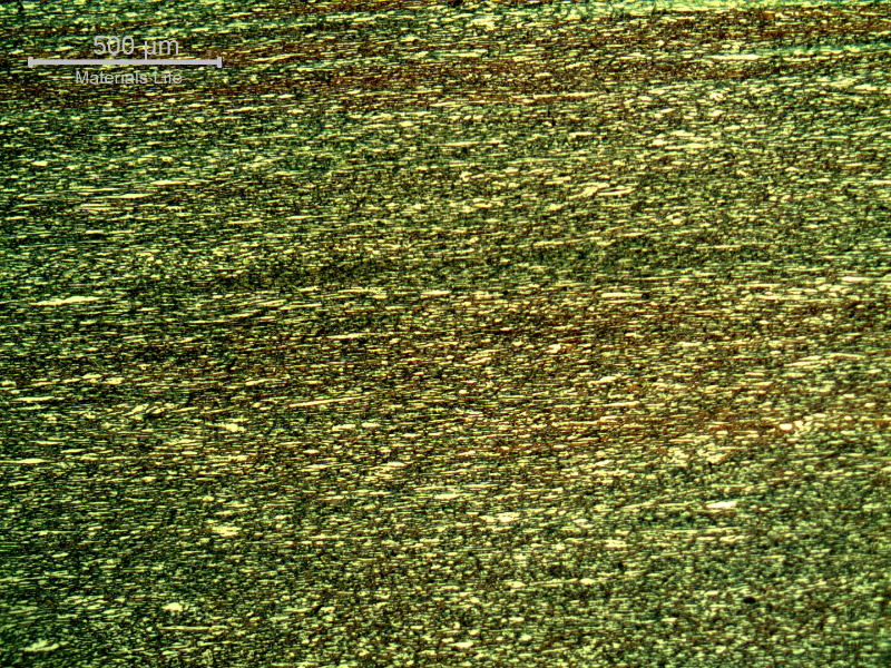 Micrography of a transverse section of the pipe, presenting a refined duplex structure. The ferrite is blue/red and the austenite is white/yellow.