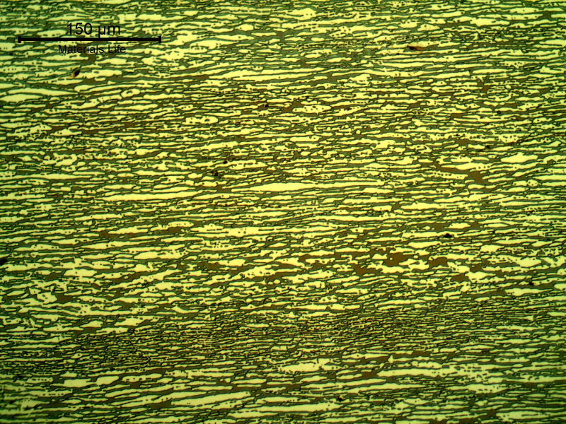 Micrography of a transverse section of the pipe, presenting a refined duplex structure. The ferrite is blue/red and the austenite is white/yellow.