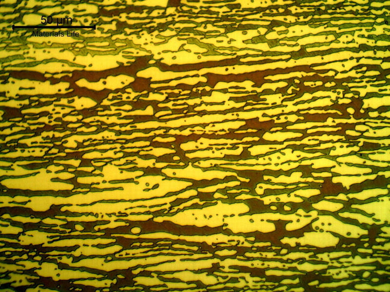 Micrographic detail of the ferritic/austenitic structure of the pipe, in a transverse section. The ferrite is blue/red and the austenite is white/yellow.