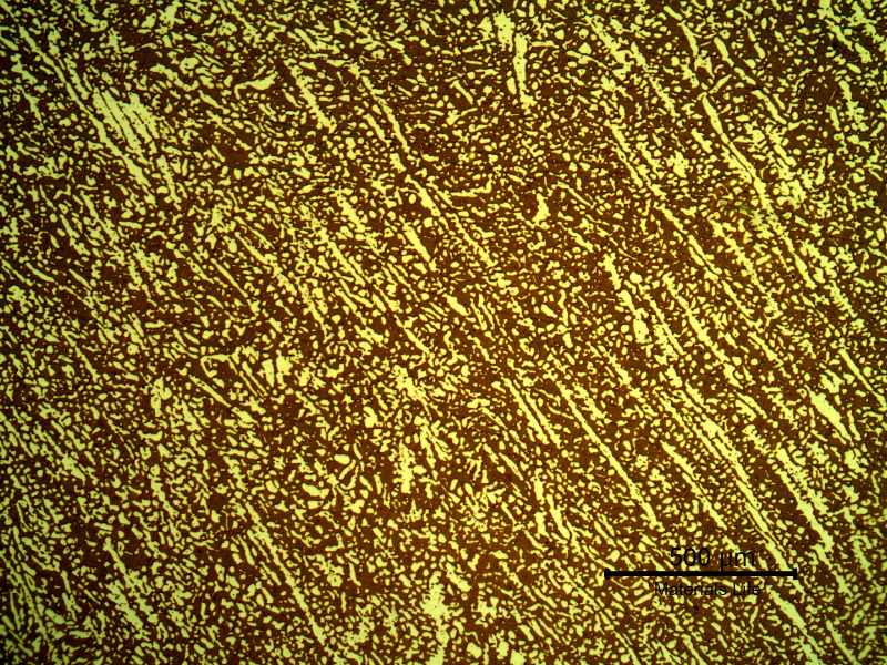 Micrography of a transverse section of the fititng, presenting a coarser structure. The ferrite is blue/red and the austenite is white/yellow.