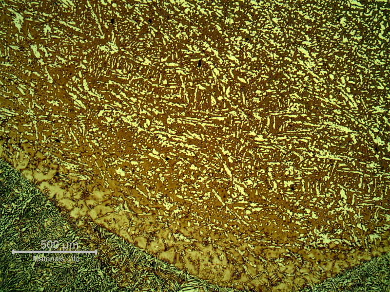 Micrography of the heat affected zone of the pipe to the fitting, at the fitting position. The fitting is welded in the thickness.  The fusion line is in the bottom of the figure.
