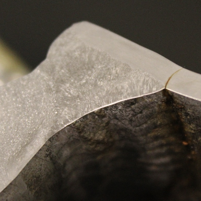 Detail of the fatigue cracking, staring from the margin of the weld. The crack propagated though wall of the pipe (5 mm).  The larger thickness of the weldolet requires a large amount of deposited weld metal, about 20 mm that is 4 times the pipe thickness. It is an interesting aspect to be considered by designers.