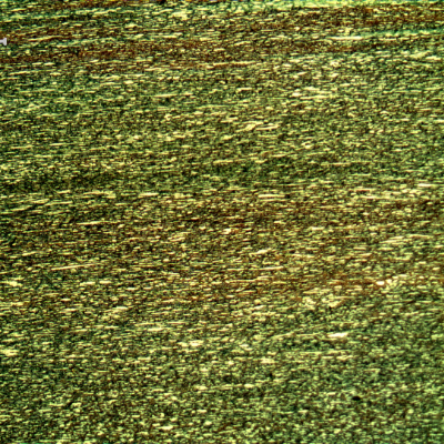 Micrography of a transverse section of the pipe, presenting a refined duplex structure. The ferrite is blue/red and the austenite is white/yellow.