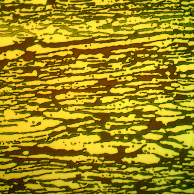 Micrographic detail of the ferritic/austenitic structure of the pipe, in a transverse section. The ferrite is blue/red and the austenite is white/yellow.