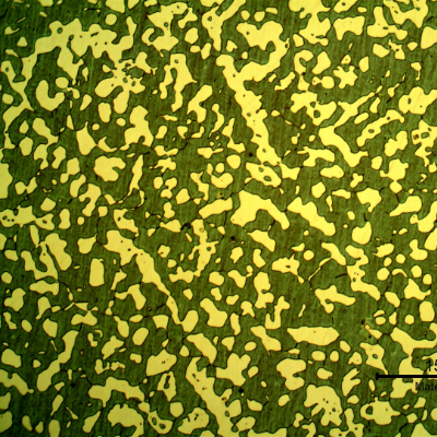 Micrography of a transverse section of the fititng, presenting a coarser structure. The ferrite is blue/red and the austenite is white/yellow.
