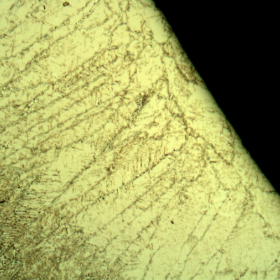 Cap pass in the weld metal, presenting a large amount of delta ferrite (retained) due to a probable quick cool of the pool during welding (since this pass is too thin, perhaps a remelting).  Although it is not good to present this microstructure, it did not affect the failure.