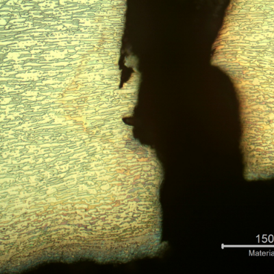 Micrographic detail of the final crack propagation through wall, with plastic deformation.