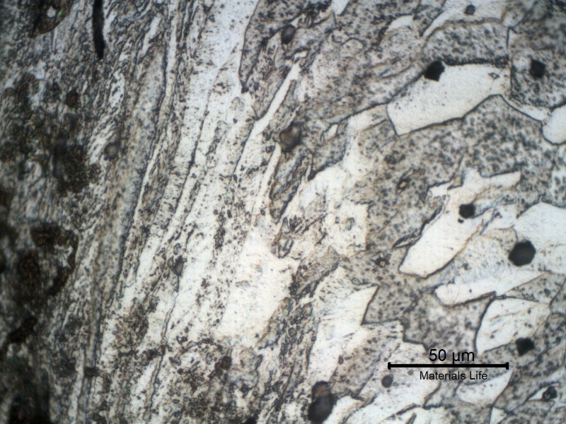 Micrographic detail of the strong plastic deformation at the edge of the scoop in the tooth cutting location. The hardness at this region of strong plastc deformation is about 240HV1.
