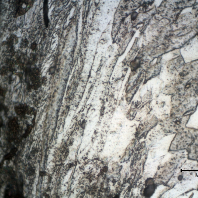 Micrographic detail of the strong plastic deformation at the edge of the scoop in the tooth cutting location. The hardness at this region of strong plastc deformation is about 240HV1.