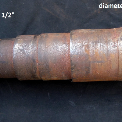 The shaft was removed from service without a failure. It was 4' long and the diameters varied from 2 1/2" to 4 1/2". It was analyzed to be specified for purchasing a new one but properties evidenced bad ductility and brittle behavior even at ambient temperature, associated to a microestruture "as hot rolled".