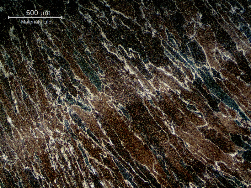 Micrography of the weld metal in the region of the cap pass that was not reheated, last bead, presenting previous austenite columnar grains, coarse.