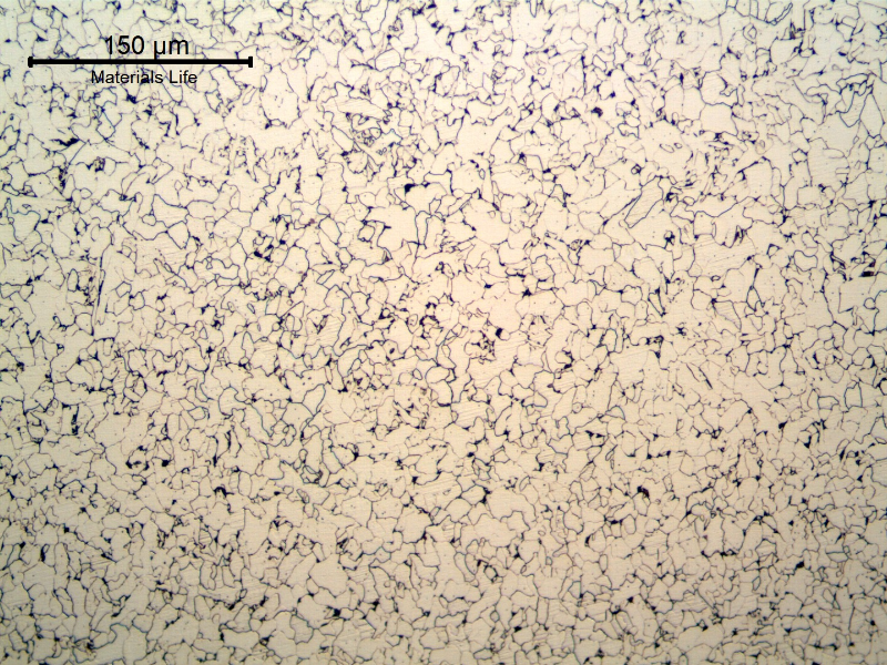 Micrography of the weld metal in the root, reheated by the fill pass, presenting a refined ferritic structure and some islands of second phases, probably agglomerated carbides.