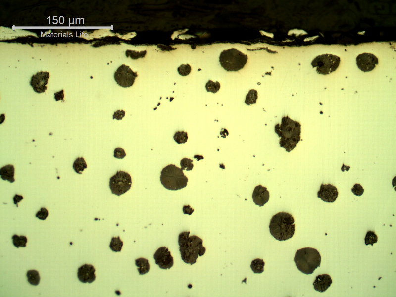 As polished micrography of the crankshaft at the shaft edge, close to the surface.  Graphite in nodules.
