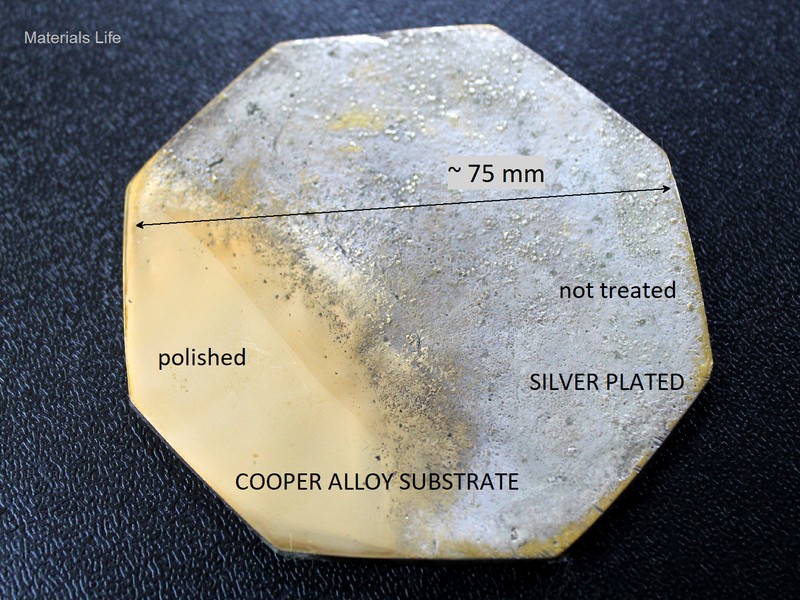 Back of the coaster showing the region that was prepared for the non destructive analysis. It was ground and polished (the coating was removed), showing the yellow aspect of the substrate, in the left bottom part of the image.
