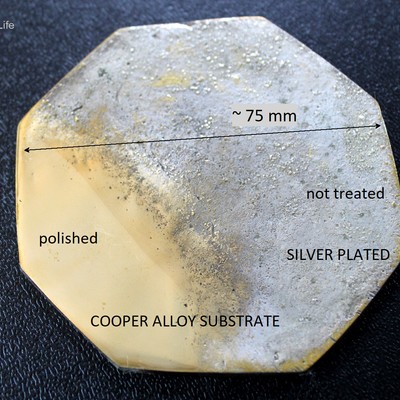 Back of the coaster showing the region that was prepared for the non destructive analysis. It was ground and polished (the coating was removed), showing the yellow aspect of the substrate, in the left bottom part of the image.