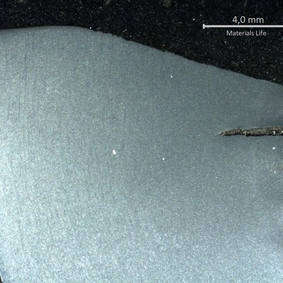 Macrography of a longitudinal section of the pipe at the fracture position, in the thicker thickness.  The  external side of the pipe (OD) is to the rigth side of the figure, and the internal side of the pipe is to the left of the figure.  There are several secondary cracks, opened to the OD, created during bending.