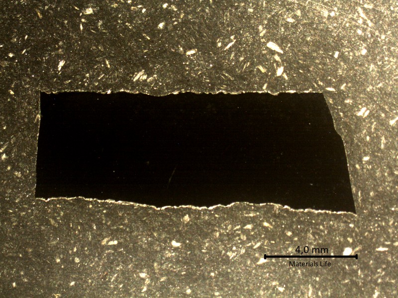 Longitudinal section macrography of the plate where the degradation by thinning is reducing the thickness from 6mm to 4mm (sample 3). The thinning is occurrring from the product reaction side (side A to the bottom of the figure).