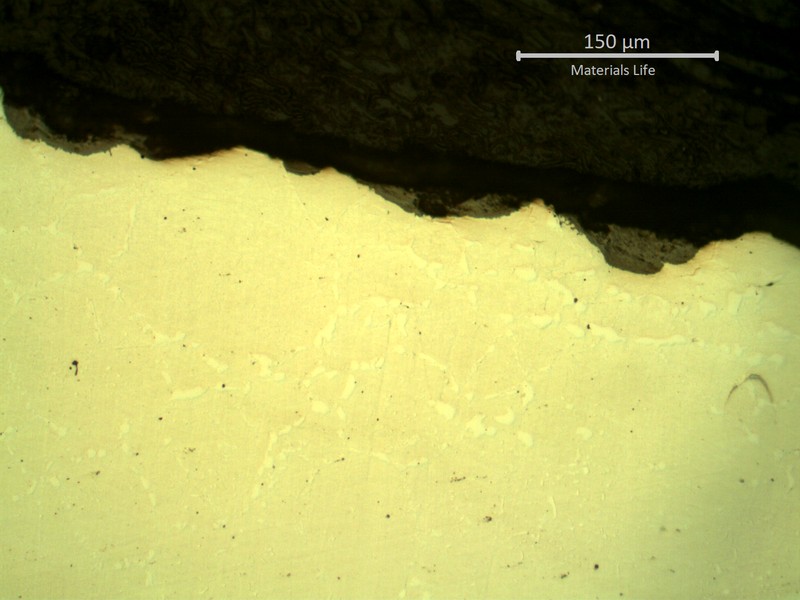 SAMPLE 3, CLOSE TO THE SURFACE OF SIDE B - Micrography, as polished, of the oxides at the electric furnace environment side.  In this region the oxide layer is thinner than in the process side.