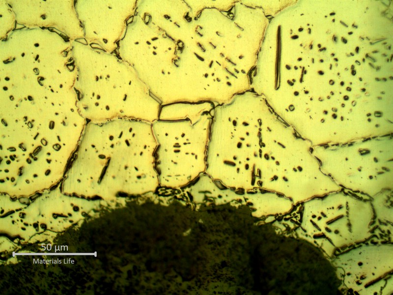 SAMPLE 1 AT 1 mm THICKNESS, SIDE A - Micrographic detail of the austenite with secondary precipitation, close to the surface exposed to the process side.  This oxalic acid electrolytic etch is revealing the sigma phase at austenite grain boundaries that is probably intensifying the intergranular oxidation, creating cracks and grain detachemnt leading to quick thinning.