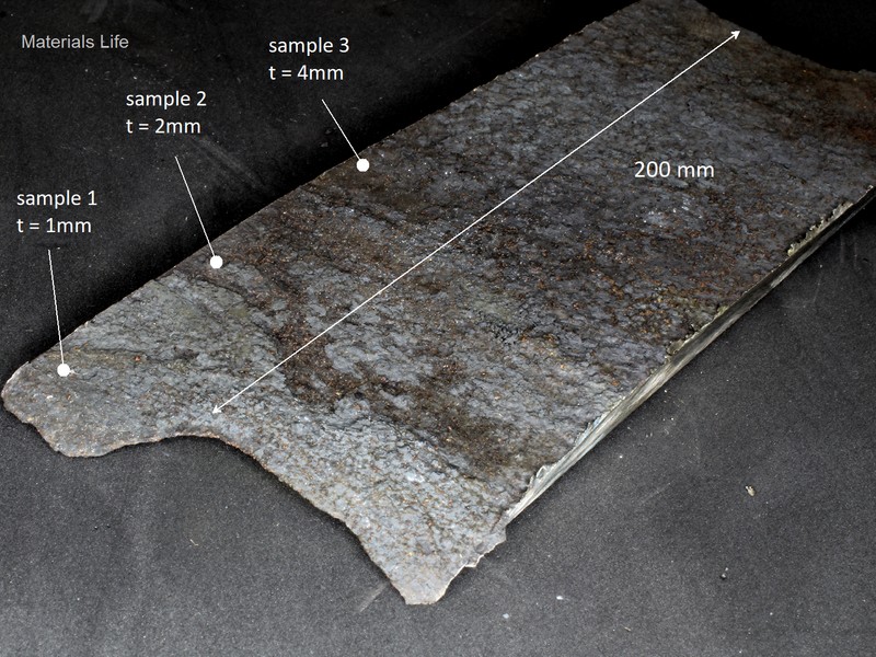 Aspect as received, side A, of the part removed from the rectangular tube that was manufactured from plates, and originally presented two welded seams (not included in the sample). Close to the edges of the sample, where probably were the corners of the rectangular tube, the degradation is in a highest level. Three samples were analysed, with different thicknesses (indicated in the figure). Side A is the side that was in contact with the reaction (product side).