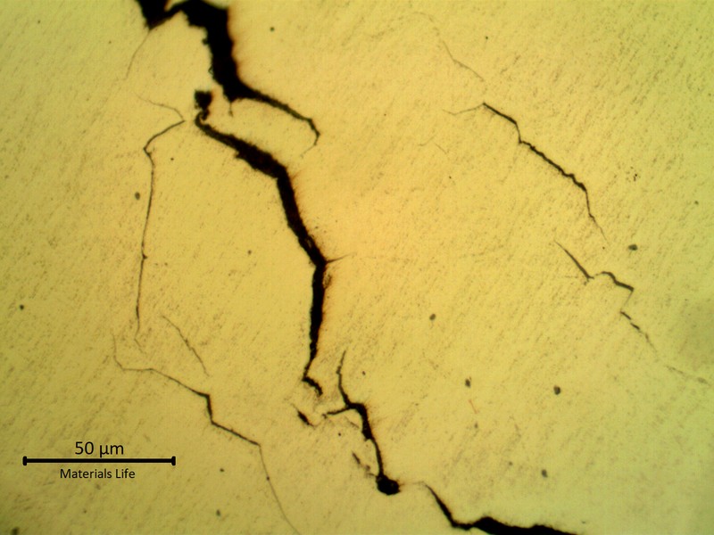 Micrographic details of cracks with brittle aspect (straight and multiple cracks).