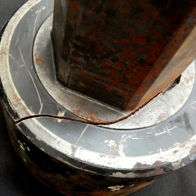 General view of the broken socket, showing no plastic deformation asociated to the rupture.  Looking from this side it is possible to see that the fracture followed the interface of the stem with the socket head.