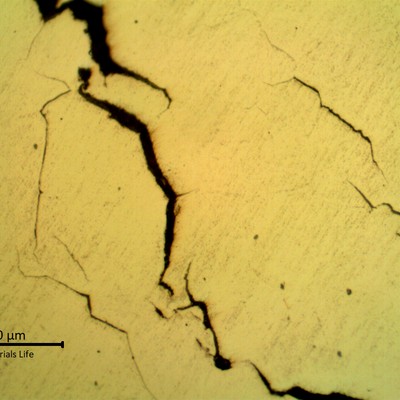 Micrographic details of cracks with brittle aspect (straight and multiple cracks).