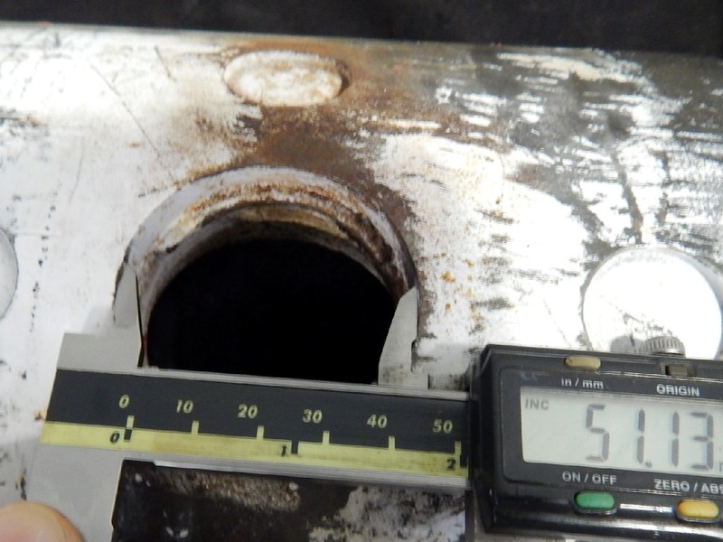 The valve body cylindrical diameter is 6 5/8" and the actuator hole in the body is about 2" diameter.  The crack is associated to the hole edge, propagating transverse to the body.