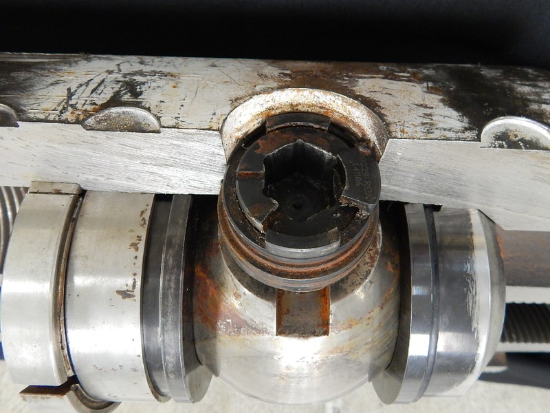 The figure illustrates the position of the ball and seats, as well as the valve actuator.  The crack is located at the edge of the actuator hole, transverse to the cylindrical body.