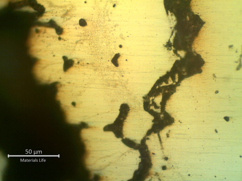 Micrographic detail, as polished, of the hot cracks with rounded interdenritic morphology.