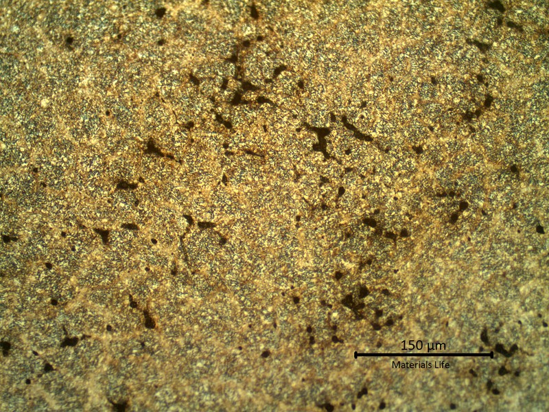 Micrography of the weld repair at the fusion line.  At this magnification it is possible to identify several voids at interdendritic positions.