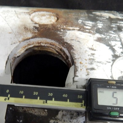 The valve body cylindrical diameter is 6 5/8" and the actuator hole in the body is about 2" diameter.  The crack is associated to the hole edge, propagating transverse to the body.