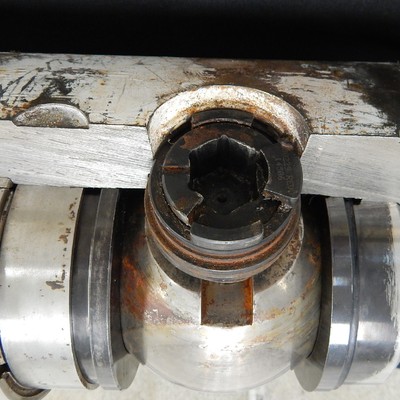 The figure illustrates the position of the ball and seats, as well as the valve actuator.  The crack is located at the edge of the actuator hole, transverse to the cylindrical body.
