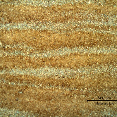 Low magnification micrography of a longitudinal section of the valve body, in the center of the thickness. As expected for this high strength steel, the microstructure is martensitic, but with segregation bands.