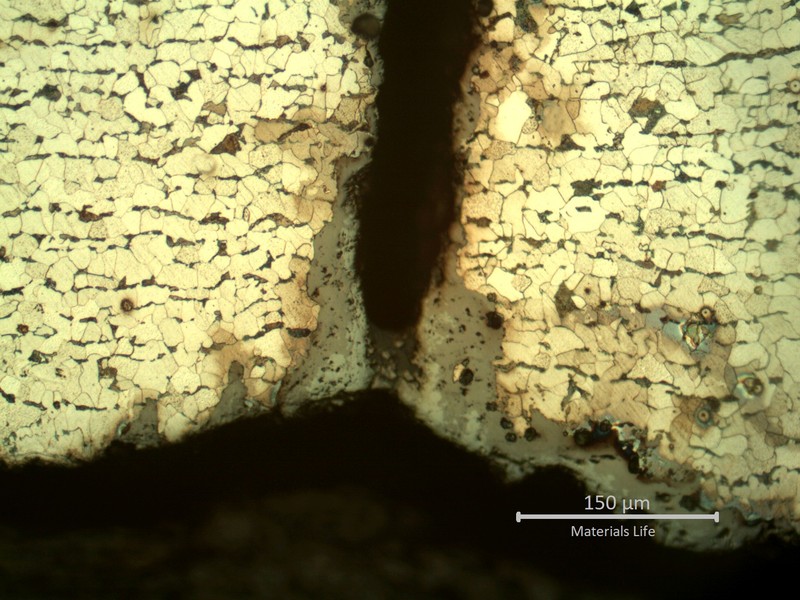 Micrography presenting the internal tube surface, with parallel cracks growthing from pits.