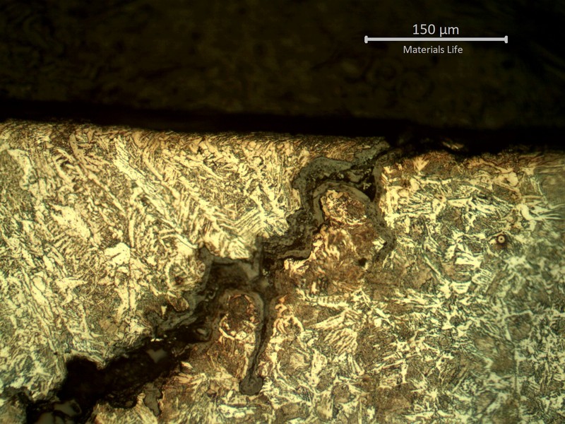 Micrography of the external tube surface, presenting the cracking at the margin of the weld. This cracking could have been created by thermal induced cycles (fatigue), but it did not propagate into the tube wall.
