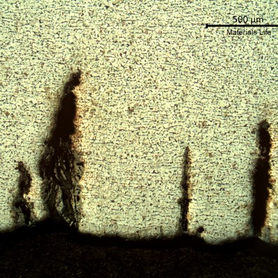 Low magnification micrography of the multiple cracks, parallel, transgranular. No evidences of microstrutural changes (heat evolution or decarburization).