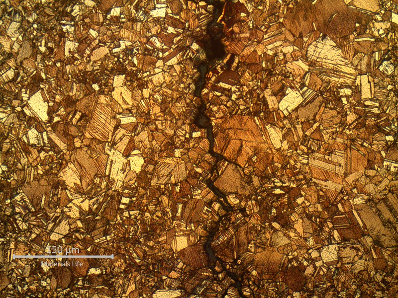 Micrography of a tube transverse section, at the through wall cracking position, showing intergranular morphology of the stress corrosion cracking.  In the center of the thickness,  far from the external surface corroded layer, the cracks are intergranular but did not present any dealloying evidence.