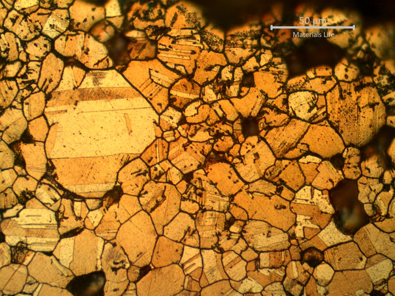 Micrographic detail of the intergranular corroded layer with evidences of selective leaching.