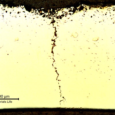 Micrography of a transverse section of the bent tube, external surface (OD) to the top and internal surface (ID) to the bottom of the figure. At the through wall cracking position, the external surface presented a layer of intergranular corrosion.
