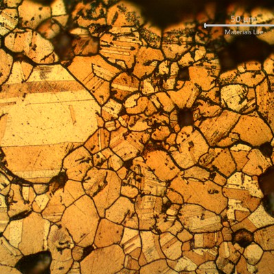 Micrographic detail of the intergranular corroded layer with evidences of selective leaching.