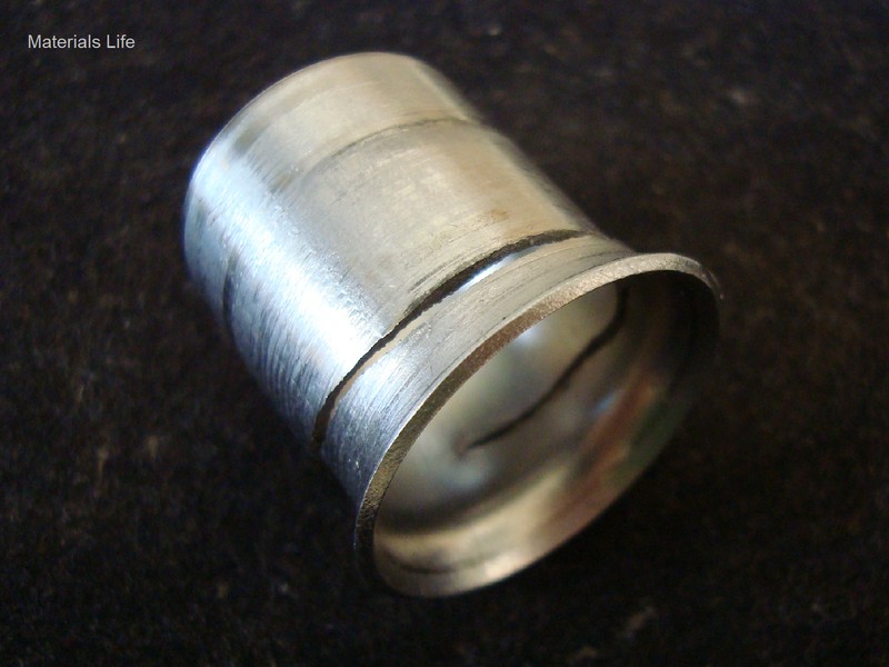 Aspect of a flared tubing, cold deformed at 37°, and the circumferential cracking.