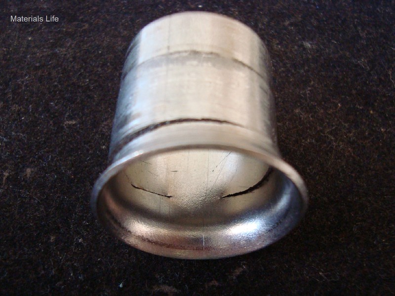Same flared tubing, with a circumferential crack, with the focus at the internal side.